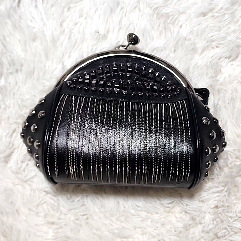 Black and Silver Cluth bag. Never used. With two different straps.